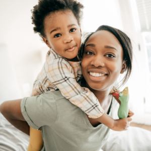 child visitation rights, african american mother carrying her son on her back