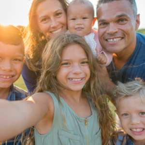 family posing for a selfie